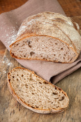 Freshly baked homemade artisan sourdough rye and white flour bread.