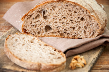 Freshly baked homemade artisan sourdough rye and white flour bread.