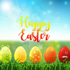 Easter background with bright easter eggs in the grass on sunny sky background
