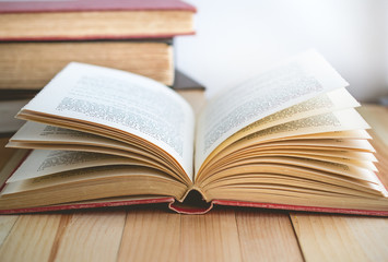 Open book and stack of books with copy space in relaxation and cozy mood, Image for education and brightness  concept