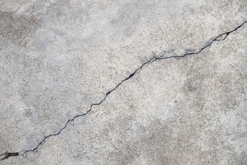 Cracked concrete texture, crack in the wall background
