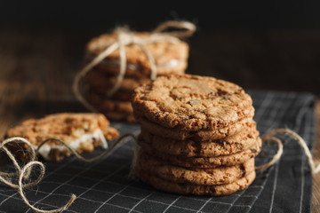 Stack of homemade cookies on black napkin 