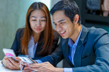 Closeup Business co-worker enjoy with smartphone in office