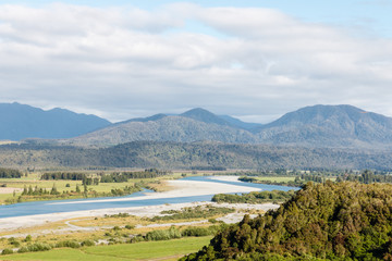 Fototapeta na wymiar aerial view of Hokitika river and Southern Alps in New Zealand