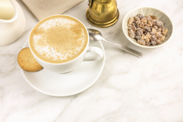 Coffee with milk, butter cookie and milk jar