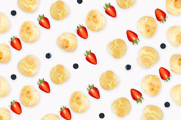 background pattern, seamless pattern, dessert background pattern,  Choux Cream with fresh blueberry and strawberry decorated on white background pattern.