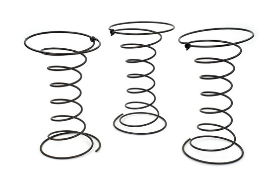 Three Black Wire Springs used in Upholstery on white background