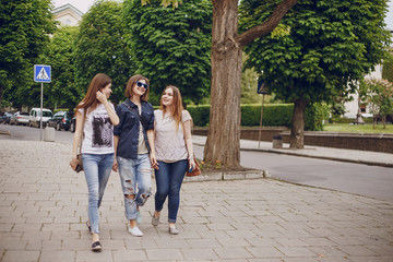 Fototapeta na wymiar three beautiful girls on walk