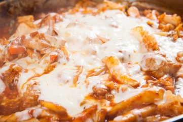 Spicy Stir-fried Chicken with cheese. It's a Korean style cuisine.	