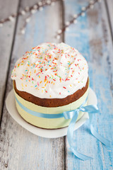 Easter cake Kulich with icing and sprinkles