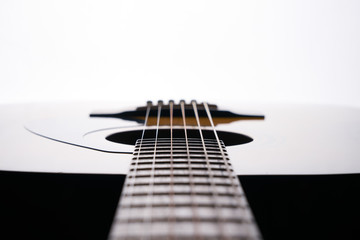 Close-up of acoustic classical guitar isolated on background.