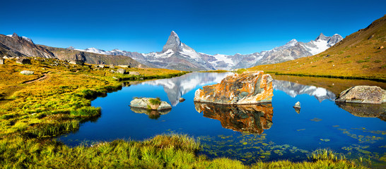 Colorful summer panorama of the Stellisee lake. - obrazy, fototapety, plakaty
