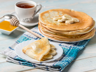 Stack of pancakes with banana topping