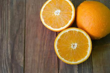 oranges on wooden background, top view.