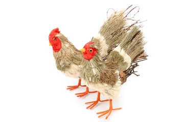 Decorative rooster and hen prepared from natural materials. Easter decoration. Interior, garden decor. Rooster prepared from branches and straws. Isolated on white background. Side view.