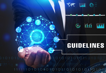 Business, Technology, Internet and network concept. Young businessman working on a virtual screen of the future and sees the inscription: Guidelines