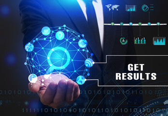 Business, Technology, Internet and network concept. Young businessman working on a virtual screen of the future and sees the inscription: Get results
