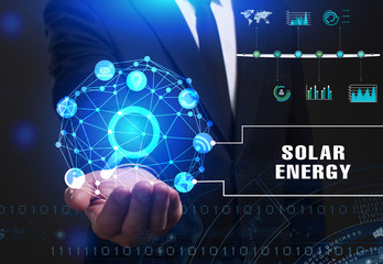 Business, Technology, Internet and network concept. Young businessman working on a virtual screen of the future and sees the inscription: Solar energy