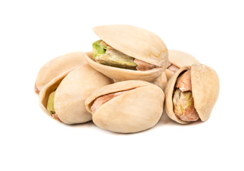 Several pistachio nuts on a white background