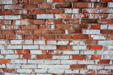 Old brick wall with white and red bricks