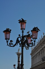 Fototapeta na wymiar Venice, Italy - 19 August 2013: the street lamp of San Marco square.