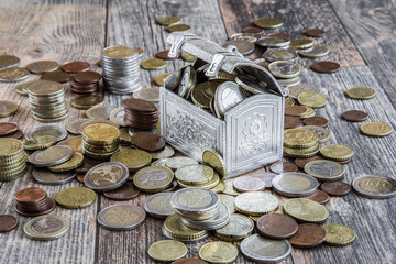 Money on the wooden table. Euro coin stocks from different countries.