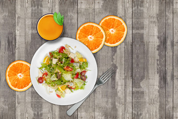 Dietary food. Salad, orange and clean page