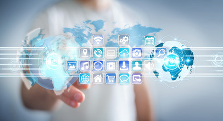 Businessman connecting worlds to icons and applications software 3D rendering