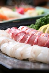 assorted sliced raw fish.