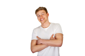 Fototapeta premium Young man smiling over white background.