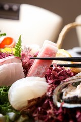 assorted sliced raw fish.