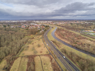 Landscape with highway and canal or river with drone