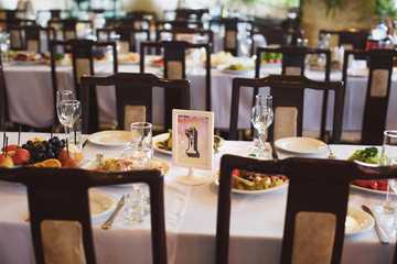 A card with a number on the wedding table