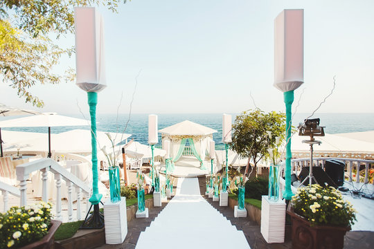 Wedding arch in Tiffany color on the beach.