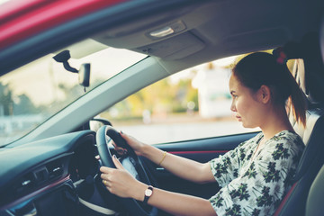 Fototapeta premium young woman happy in car