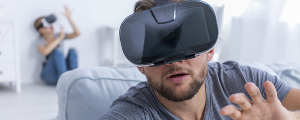 Fascinated man with virtual reality glasses