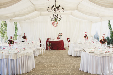 Beautiful Banquet hall under a tent for a wedding reception.
