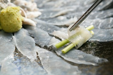 blow fish with chopsticks © Macus