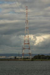 Electricity supply towers and structures transmit power along high voltage wires and cables