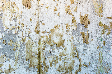 White texture of wall with peeled paint, background