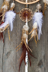 Dreamcatcher made of feathers, leather, beads, and ropes