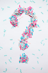 question mark from the pieces of paper pink and blue colors
