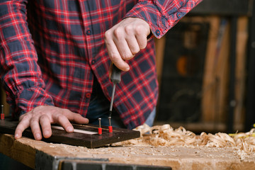 carpenter working in workshop. Close-up.