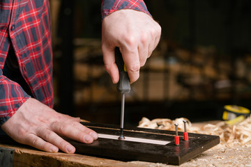 carpenter working in workshop. Close-up.
