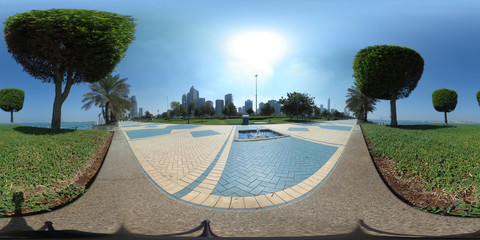 360 degrees spherical panorama of the abu dhabi (UAE) corniche with view of the skyline an blue...