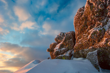 rock covered with snow and fog