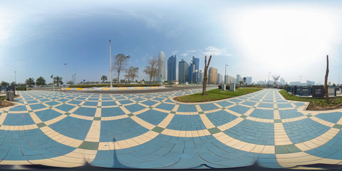 360 degrees spherical panorama of the abu dhabi (UAE) corniche with view of the skyline an blue...