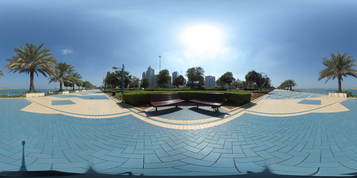 360 degrees spherical panorama of the abu dhabi (UAE) corniche with view of the skyline an blue water