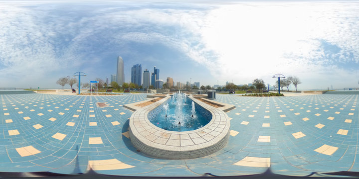 360 degrees spherical panorama of the abu dhabi (UAE) corniche with view of the skyline an blue water