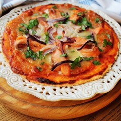 Pizza with mozzarella cheese , salmon, onion